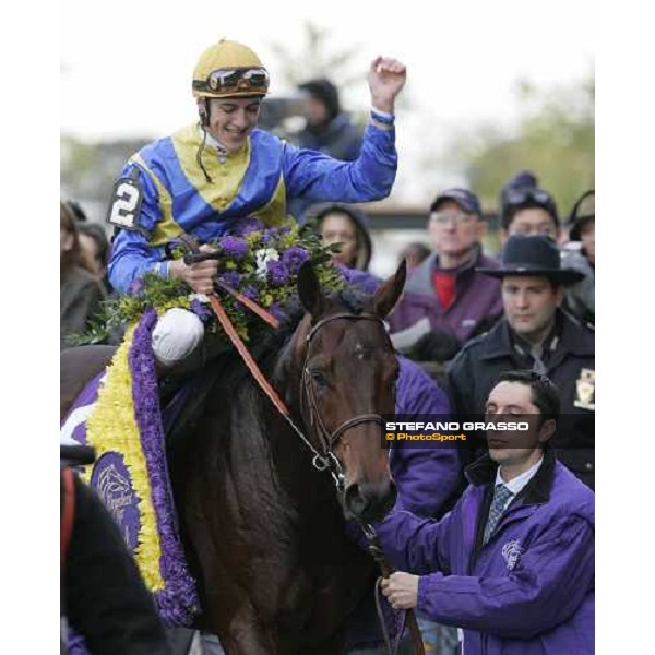 Christophe Soumillon enters in triumph in the winner circle after winning with Shirocco the John Deere Breeders\' Cup Turf New York, 29th october 2005 ph. Stefano Grasso