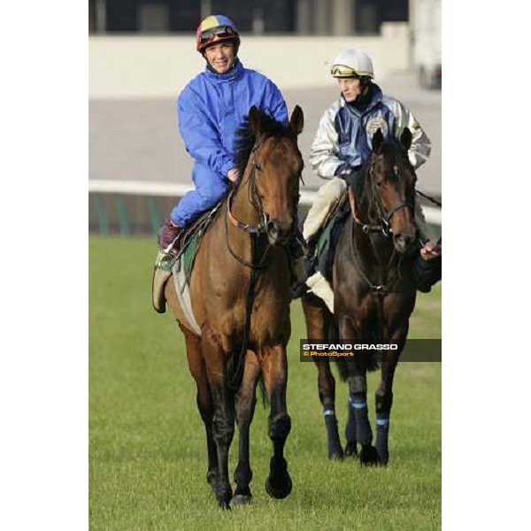 Frankie Dettori on Alkaased followed by Kieren Fallon on Oujia Board after morning track works at Fuchu race course Tokyo, 25th november 2005 ph. Stefano Grasso