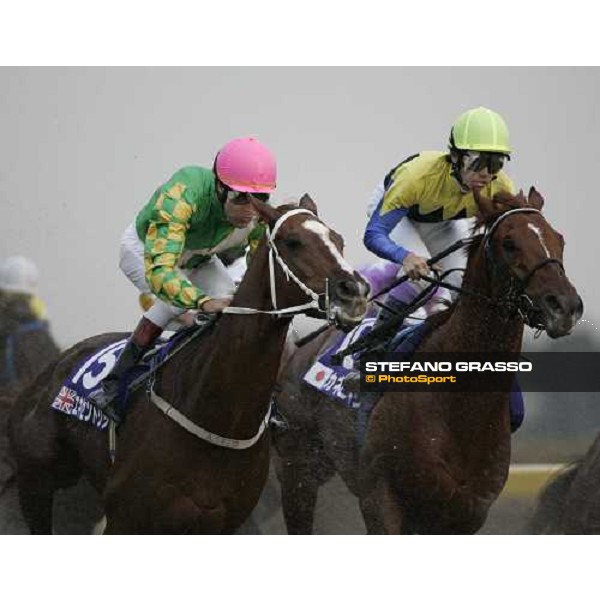 Yutaka Take inside on Kane Hekili and Darryll Holland on Eccentric on the first turn of the Japan Cup Dirt at Fuchu race course Tokyo, 26th november 2005 ph. Stefano Grasso