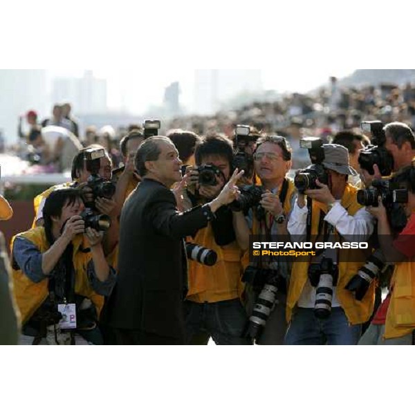 Derek Cruz surrounded from photographers after winning with Natural Blitz the Cathay Pacific Hong Kong Sprintat Sha Tin race course Hong Kong, 11th december 2005 ph. Stefano Grasso