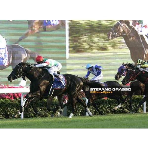 at last few meters to the line Olivier Peslier on Hat Trick leads the group and wins the Cathay Pacific Hong Kong Mile Hong Kong, 11th dec. 2005 ph. Stefano Grasso