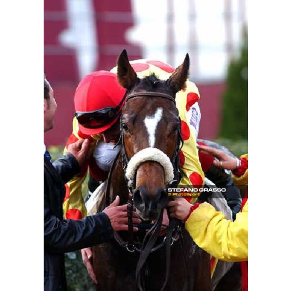 \'Mirko Simonaggio embraces Miss Vegas in the winner circle of Capannelle race track Rome, nov. 16 2003-ph.Stefano Grasso\' 