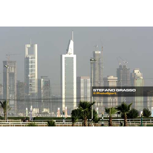 morning track works at Nad El Sheba racetrack with the Dubai Skyline on the backside Dubai, 23rd march 2006 ph. Stefano Grasso