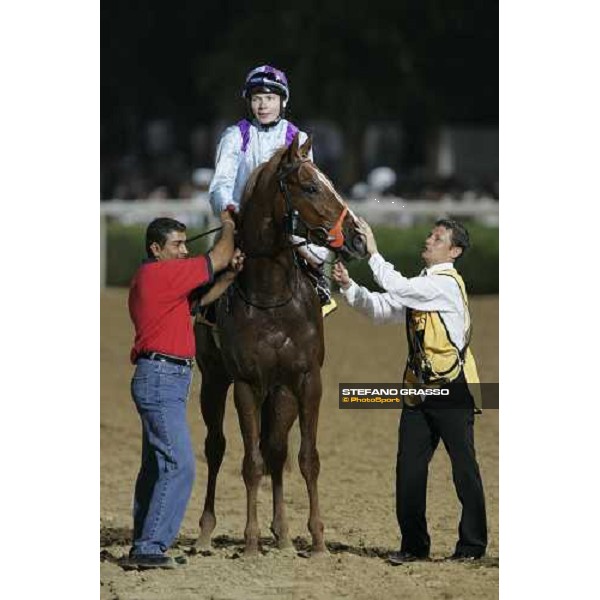 Jamie Spencer in triumph on David Junior after winning the Dubai Duty Free Nad El Sheba, 25th march 2006 ph. Stefano Grasso