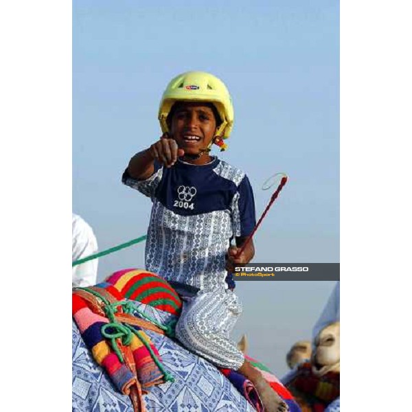 young child rides a camel during camels\' training Dubai 28th march 2004 ph. Stefano Grasso