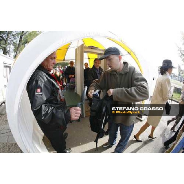 racegoers enter at Pardubice racetrack for the 116.¡ Velka Pardubicka Pardubice race track, 8th october 2006 ph. Stefano Grasso