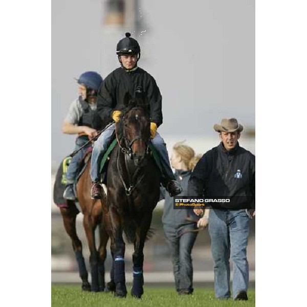 Jason Tate on Ouja Board with Robin Trevor Jones at right and followed by Claude Lenoir on Freedonia comes back after morning trackworks at Fuchu racecourse Tokyo, 24th nov. 2006 ph. Stefano Grasso