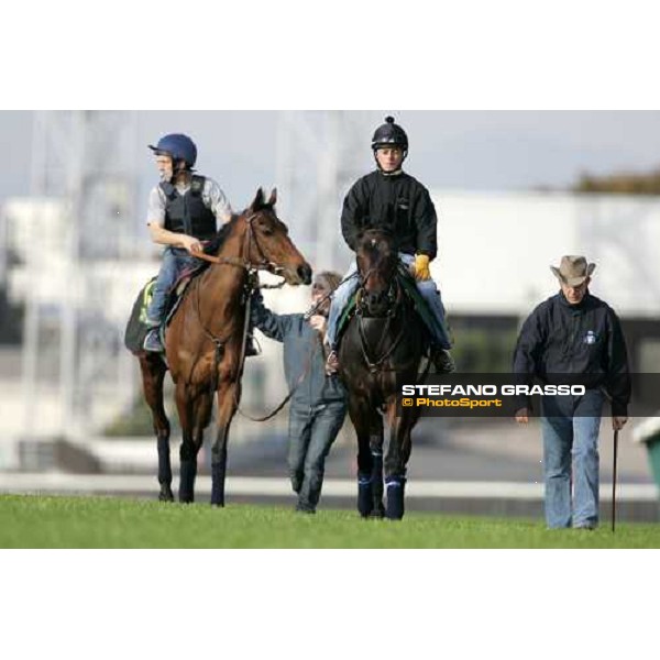 Jason Tate on Ouja Board with Robin Trevor Jones at right and followed by Claude Lenoir on Freedonia comes back after morning trackworks at Fuchu racecourse Tokyo, 24th nov. 2006 ph. Stefano Grasso