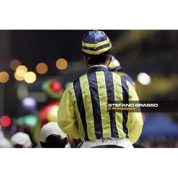 horses and jockeys parading in the paddock of Happy Valley Hong Kong, 6th dec. 2006 ph. Stefano Grasso