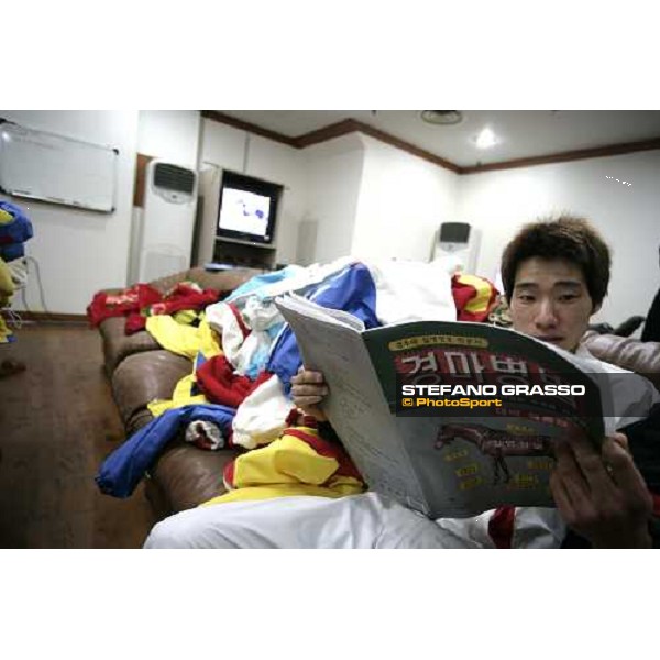 a jockey reading the racecard at Seoul race park Seoul, 16th dec. 2006 ph. Stefano Grasso