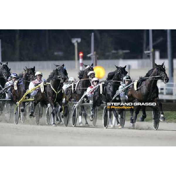 at the second turn of Gran Premio Encat \'Memorial Fausto Branchini\', Andrea Guzzinati with Express Road leads the group followed by the winner Giuseppe Ruocco with Dominatore D\'Orio and Mauro Baroncini with Faliero As. Milan, San Siro 11st febru