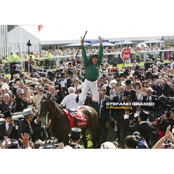 EPSOM RACECOURSE. THE VODAFONE DERBY STAKES FRANKIE DETTORI CELEBRATES IN THE WINNERS CIRCLE AFTER RIDING AUTHORIZED TO VICTORY IN THE DERBY WITH HIS TRADEMARK FLYING DISMOUNT PIC ANDY WATTS / RACINGFOTOS.COM THIS IMAGE IS SOURCED FROM AND MUST BE B