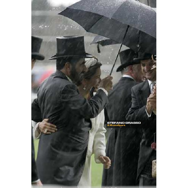 Princess Haya and Sheihk Mohammed under the storm after the giving prize of the Ribblesdale Stakes Ascot, Royal Ascot 3rd day, 21st june 2007 ph. Stefano Grasso