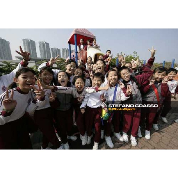 children smiling at Penfold Park, designated training center for equestrian Olympics 2008 Hong Kong, 8th dec. 2007 ph. Stefano Grasso