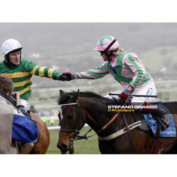 Robert \'chocolate\' Thornton on Katchit receives the congratulations from Tony Mc Coy after winning the Smurfit Kappa Champion Hurdle Challenge Trophy Cheltenham The Festival , 1st day 11th march 2008 ph. Stefano Grasso