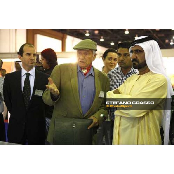 H.H. Sheikh Mohamed bin Rashid Al Maktoum leastening Monty Roberts explains he Kurt car systems at the Dubai Arabian horse show fair, with Daniele Camuffo at left Dubai, 23th march 2008 ph. Stefano Grasso