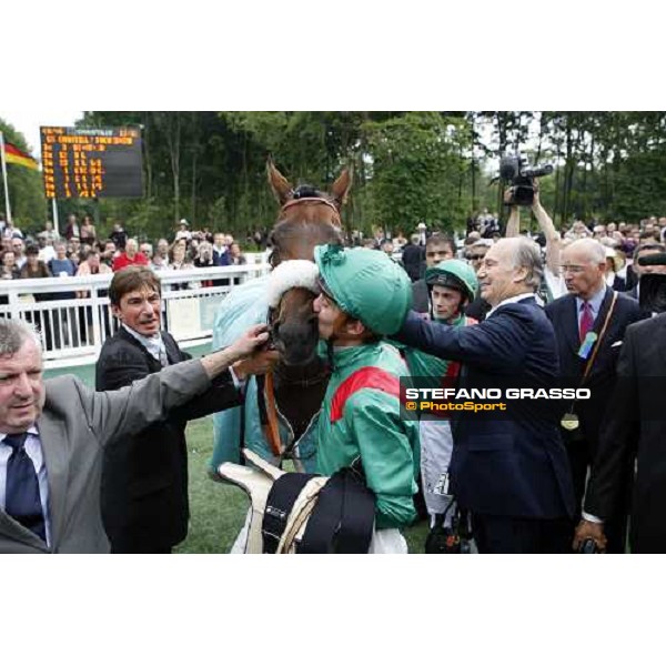 Christophe Soumillon kisses Zarkava while S.A. The Aga Khan thanks her watched by trainer Alain de Royer Dupre after winning the Prix de Diane Chantilly, 8th june 2008 ph. Stefano Grasso