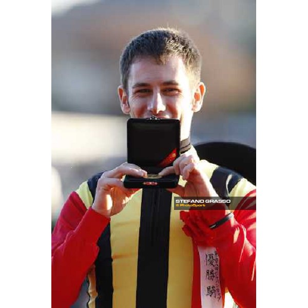 a very happy Mirco Demuro shows the medal after winning the Japan Cup at Fuchu racecourse. Tokyo, 30th nov. 2008 ph. Stefano Grasso