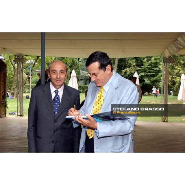 Luciano Salice owner of Falbrav signs the book \' Falbrav an italian story\' Gran Premio di Milano Milan San Siro 20th june 2004 ph. Stefano Grasso