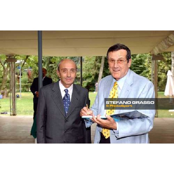 Luciano Salice owner of Falbrav signs the book \' Falbrav an italian story\' Gran Premio di Milano Milan San Siro 20th june 2004 ph. Stefano Grasso