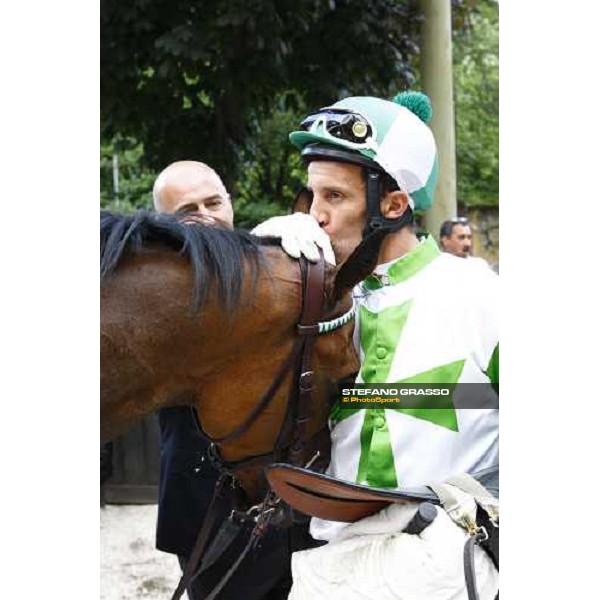 a kiss to Sharstar by Raffaele Romano in the winner circle of the 1¡ Grande Steeple-Chase d\' Europa Merano, 21st june 2009 ph. Stefano Grasso
