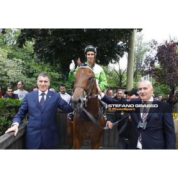 Paolo Favero, Raffaele Romano on Sharstar and Rodolfo Casieri pose for the photographer in the winner circle of the 1¡ Grande Steeple-Chase d\' Europa Merano, 21st june 2009 ph. Stefano Grasso