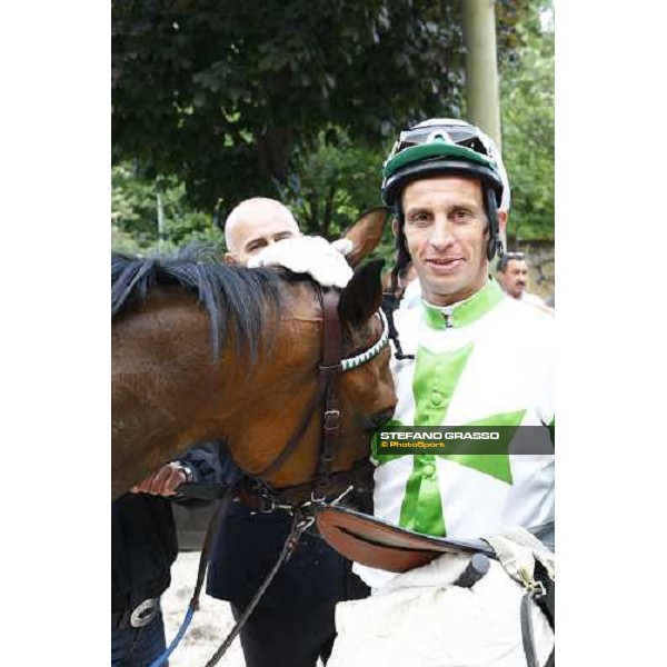 a caress to Sharstar by Raffaele Romano in the winner circle of the 1¡ Grande Steeple-Chase d\' Europa Merano, 21st june 2009 ph. Stefano Grasso
