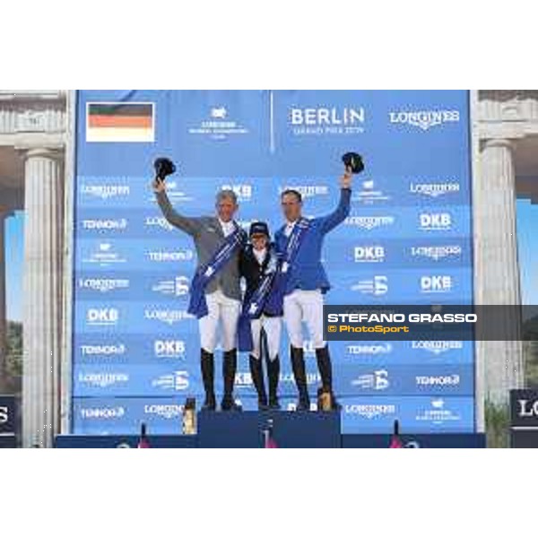 LGCT of Berlin - Grand Prix Prize giving ceremony - The podium: 1st Danielle G. Waldman (ISR), 2nd Ludger Beerbaum (GER) and 3rd Christian Ahlmann (GER) - Berlin, Sommergarten - 27 July 2019 - ph.Stefano Grasso/LGCT