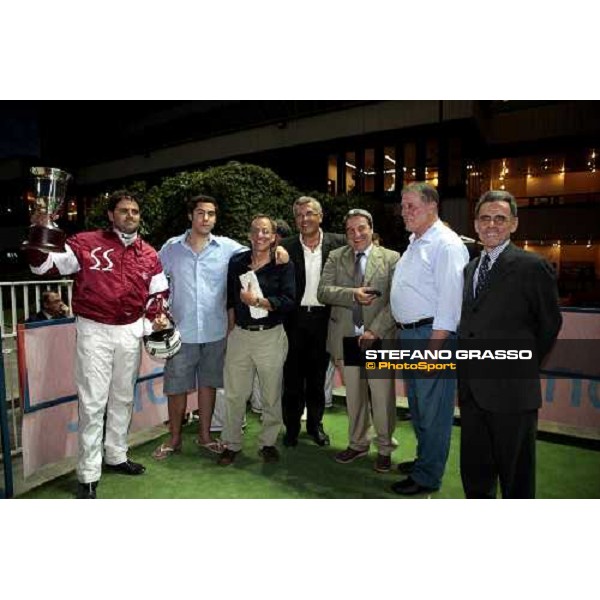 Massimiliano Castaldo stands the cup after winning the Gran Premio Nazionale Filly- Trofeo Snai - Memorial Eva and Aldo Vecchioni- close to him Roberto Vecchioni Milan, 2nd july 2009 ph.Stefano Grasso