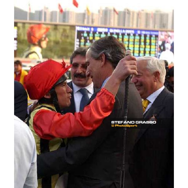 Frankie embraces Luca Cumani in the winner circle Sha Tin 141203 ph. Stefano Grasso