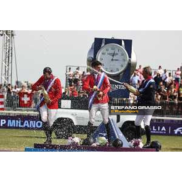 FEI Jumping European Championship Milano 2023 - Milano, San Siro galopp racecourse - 3 September 2023 - ph.Stefano Grasso Champagne celebration - Steve Guerdat, Philipp Weishaupt and Julien Epaillard