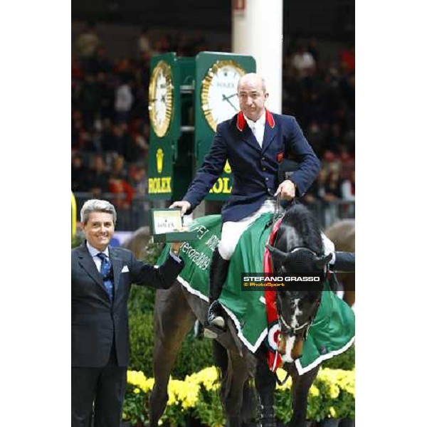 Michael Whitaker on Insultech Amai winners of the Jumping Verona - Rolex Fei World Cup tm 2009 receives the Rolex watch by dott. Marini of Rolex Italia Verona, 8th nov. 2009 ph.Fieracavalli/Stefano Grasso