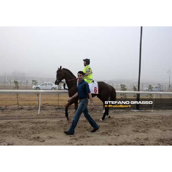 Marco Botti walks back to the stable with Gitano Hernando after a canter Dubai - Meydan, 25th march 2010 ph. Stefano Grasso