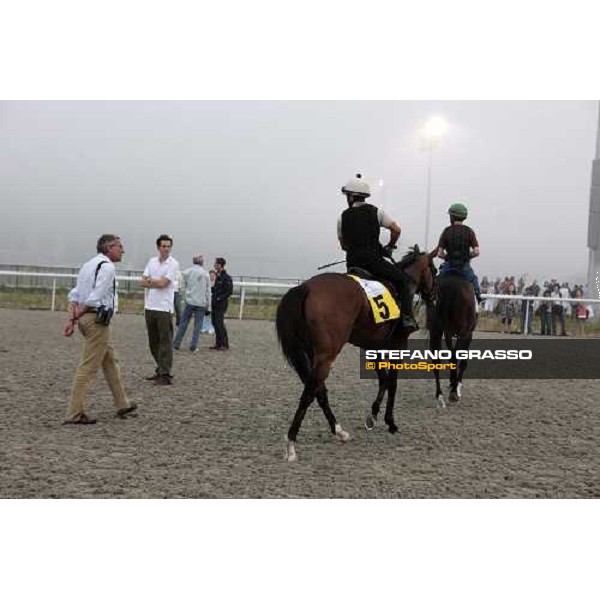 Luca and Matteo Cumani watching Presvis after a canter Dubai - Meydan, 25th march 2010 ph. Stefano Grasso