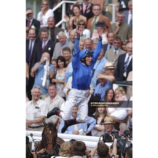Dettori dismounts from Sulamani after winning the International at York 17-8-04 -pic. Bill Selwyin