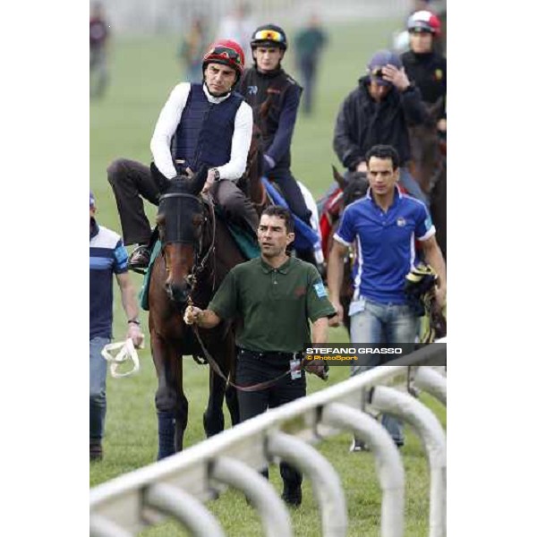 Morning track works at Sha Tin racecourse - Endo Botti on Jakkalberry leads a group of horses going to the morning worksout Hong Kong- Sha Tin, 10th dec. 2010 ph. Stefano Grasso