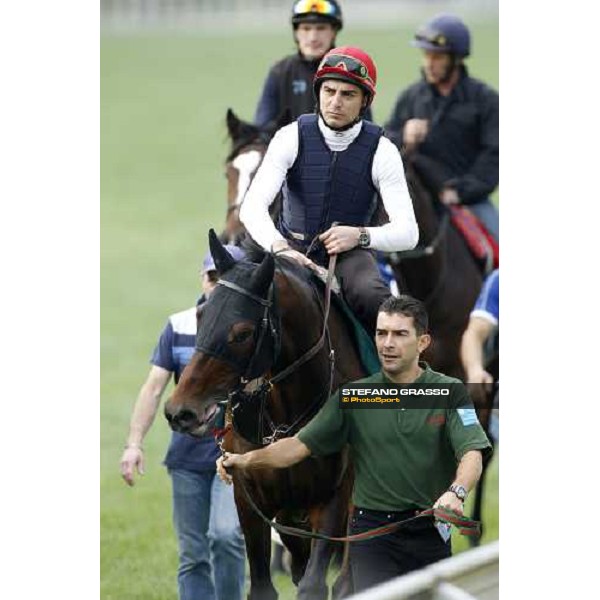 Morning track works at Sha Tin racecourse - Endo Botti on Jakkalberry leads a group of horses going to the morning worksout Hong Kong- Sha Tin, 10th dec. 2010 ph. Stefano Grasso