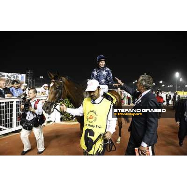 Luca Cumani congratulatres with Ryan Moore and Presvis after winning the Dubai Duty Free Dubai - Meydan, 26th march 2011 ph.Stefano Grasso