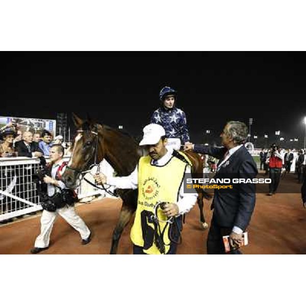 Luca Cumani congratulatres with Ryan Moore and Presvis after winning the Dubai Duty Free Dubai - Meydan, 26th march 2011 ph.Stefano Grasso