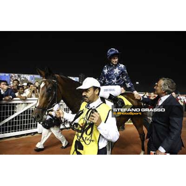 Luca Cumani congratulatres with Ryan Moore and Presvis after winning the Dubai Duty Free Dubai - Meydan, 26th march 2011 ph.Stefano Grasso