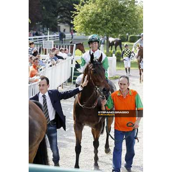 Umberto Rispoli on Sir Eagles and Andrea Marcialis enter the winner enclosure after winning the Premio Certosa Milan- San Siro racetrack, 24th april 2011 ph.Stefano Grasso
