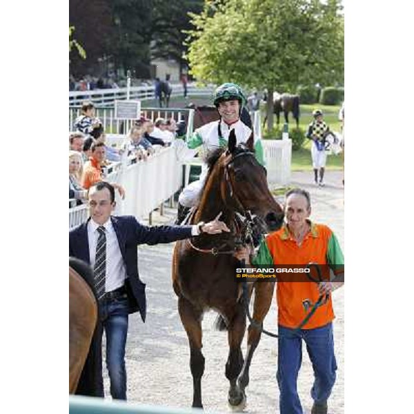 Umberto Rispoli on Sir Eagles and Andrea Marcialis enter the winner enclosure after winning the Premio Certosa Milan- San Siro racetrack, 24th april 2011 ph.Stefano Grasso