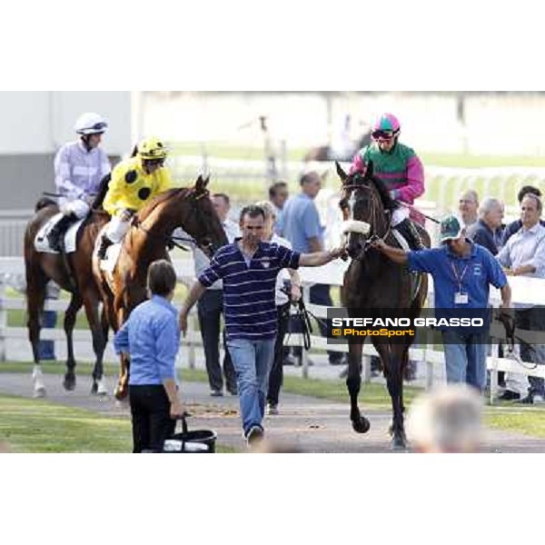 Mirco Demuro on Khor Sheed and Umberto Rispoli on Adamantina parade before the start of the Premio Sergio Cumani Milano - San Siro racetrack, 24th sept.2011 ph.Stefano Grasso