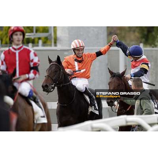 Mario Esposito on Tesey returns home after winning the Premio Conte Felice Scheibler and is congratulated by Umberto Rispoli Rome, 23rd oct. 2011 ph.Stefano Grasso