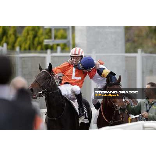 Mario Esposito on Tesey returns home after winning the Premio Conte Felice Scheibler and is congratulated by Umberto Rispoli Rome, 23rd oct. 2011 ph.Stefano Grasso