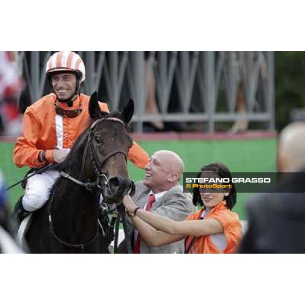 Mario Esposito on Tesey returns home after winning the Premio Conte Felice Scheibler and is congratulated by the owner Rome, 23rd oct. 2011 ph.Stefano Grasso
