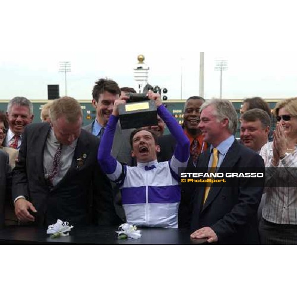 winner enclosure of Bessemer Trust Breeders\' Cup Juvenile- Frankie Dettoristands the trophy with at his right the trainer Jeremy Noseda and at left the owner Paul Reddam Dallas 30th october 2004 ph. Stefano Grasso