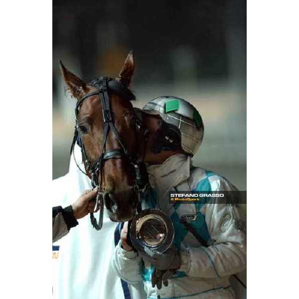 \'Andrea Guzzinati give a kiss to Zerbinal after winning Gran Premio Encat San Siro Milan january 12 2003-ph.Stefano Grasso\' 