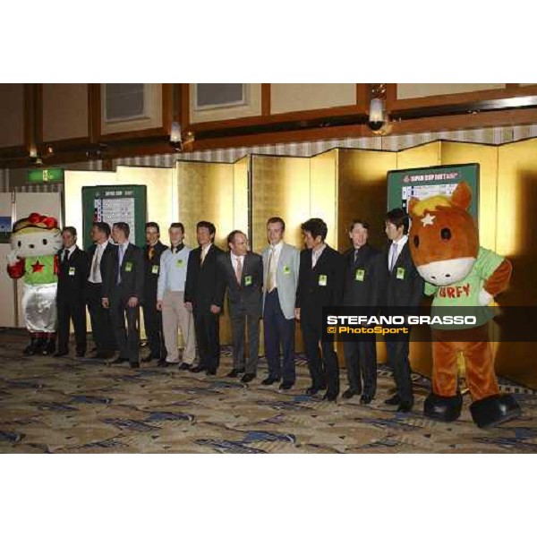 The jockeys including Kieren Fallon (2nd from rt) Yutake Take (far right) Olivier Peslier (centre leaning forward, due to ride favourite Zenno Rob Roy) at the Japan Cup welcome party. Pic Bill Selwyn 25-11-04 - Mirco Demuru first from left