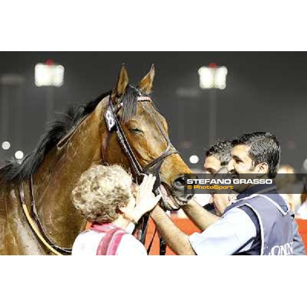 Corinne Barande Barbe enjoys Cirrus des Aigles and his groom smiling after winning the Dubai Sheema Classic Dubai World CupDubai - Meydan racecourse 31st march 2012ph.Stefano Grasso